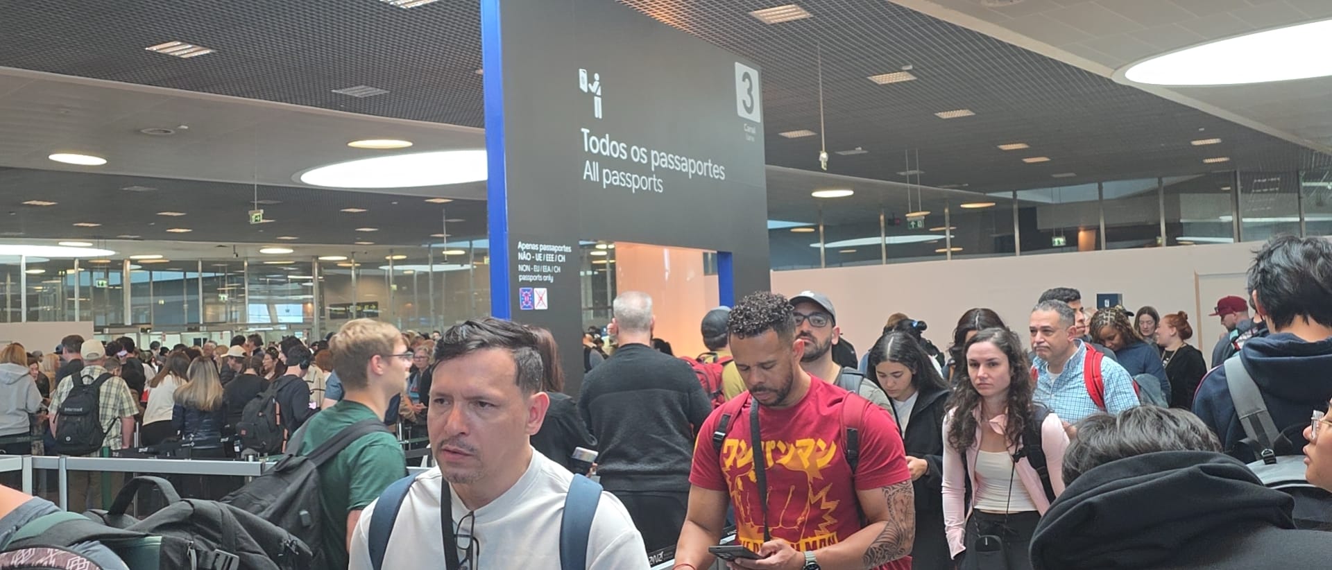 A large non-EU passport control queue at Lisbon Airport.